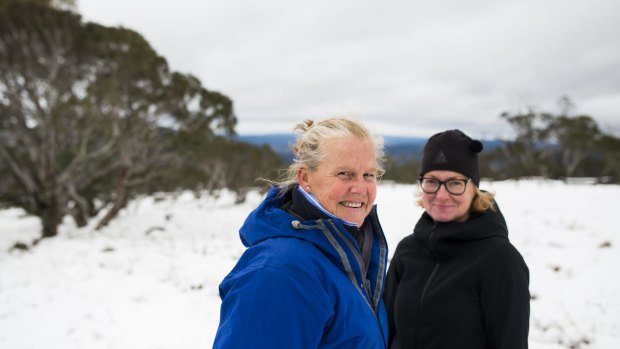 Jayne Webster and Catherine Sim from Melbourne enjoy the snow on Mt Ginini in the Brindabellas on Wednesday morning. 