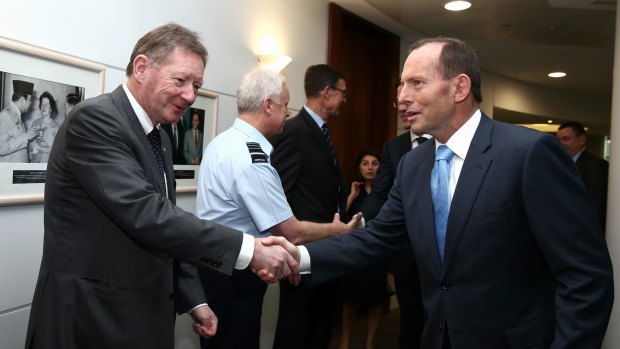 Dr Watt greets then Prime Minister Tony Abbott in 2014.