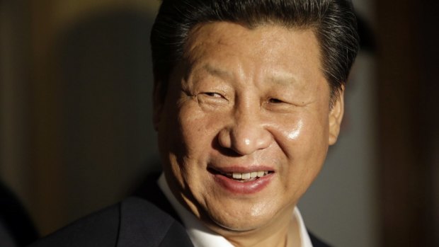 Chinese President Xi Jinping smiles as he concludes a visit to Lincoln High School in Tacoma, Washington, during his US visit.