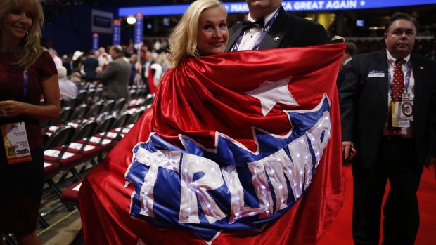 My hero: a delegate wears a Trump cape on the convention floor.