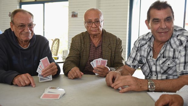 George Jianouris, George Makrus and George Hrisostomou commiserate over a game of cards.