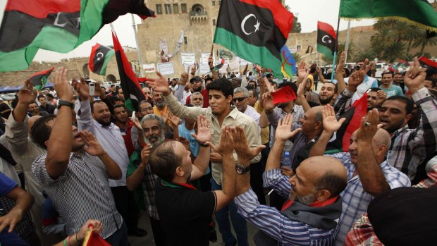 Divided nation: People celebrate the court verdict in Tripoli.
