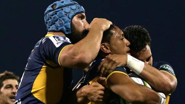 Christian Lealiifano of the Brumbies celebrates scoring a try with team mates during the round two NRL match between the Brumbies and the Waratahs at GIO Stadium on March 4. 