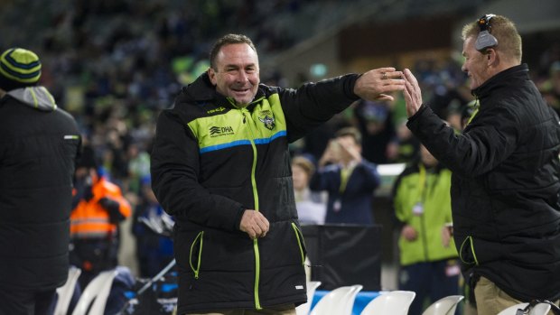 Raiders' coach Ricky Stuart celebrates the final try with assistant coach Mick Crawley.