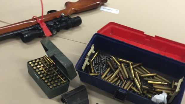 A rifle and some of the ammunition seized in Friday's raid.