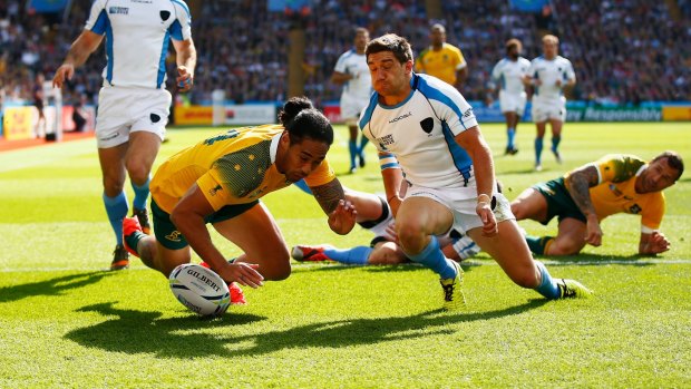 Touchdown: Joseph Tomane scores the second try during the 2015 Rugby World Cup Pool A match between Australia and Uruguay at Villa Park.