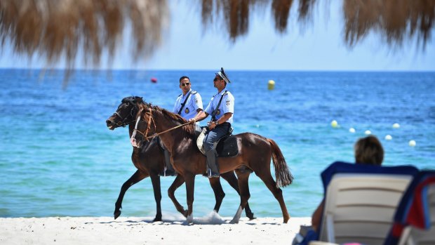 Security patrol Marhaba beach on Monday at the scene where 38 people were killed in a terrorist attack last week.