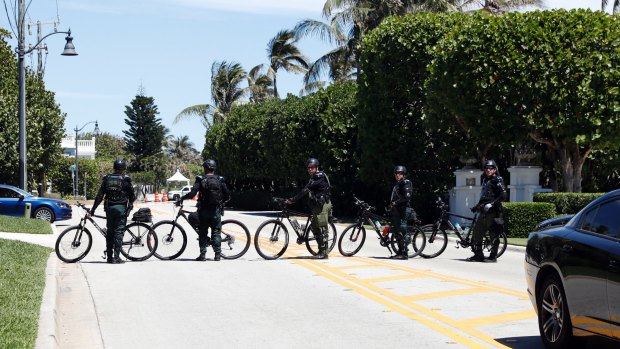 Sheriff's deputies block the street as Donald Trump and Xi Jinping meet at Mar-a-Lago.