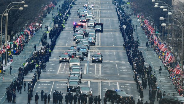 The motorcade carrying President Barack Obama and President-elect Donald Trump down Pennsylvania Avenue.