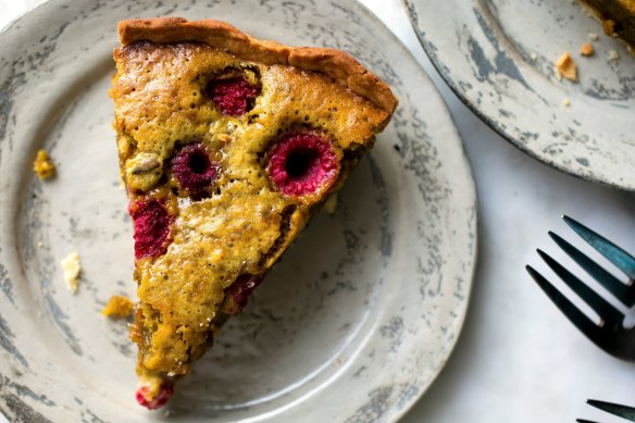 A slice of pistachio and raspberry tart.