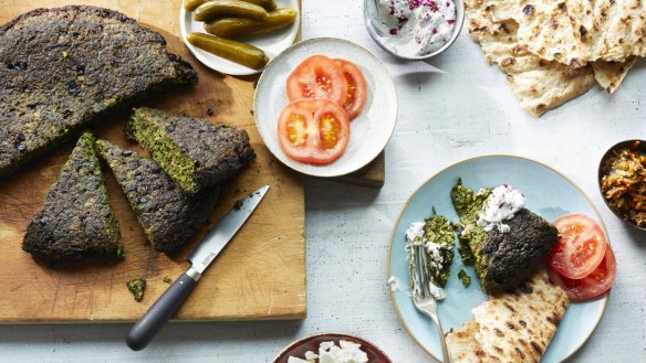 Persian herb frittata served with feta, tomato and pickles.