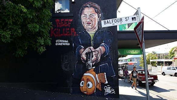 Queensland Premier Annastacia Palaszczuk depicted holding a gun to Nemo's head in an anti-Adani street mural in New Farm.