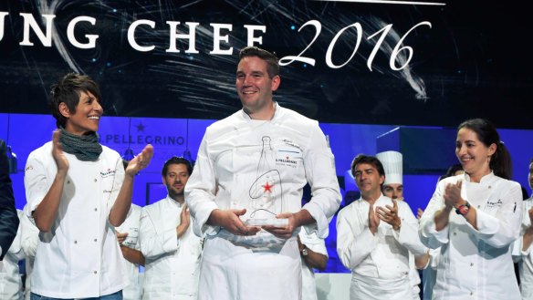 American chef Mitch Lienhard collects his trophy onstage in Milan.