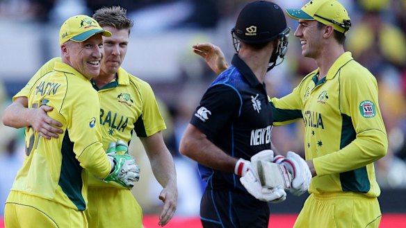 Australia's players look on as Grant Elliott departs.