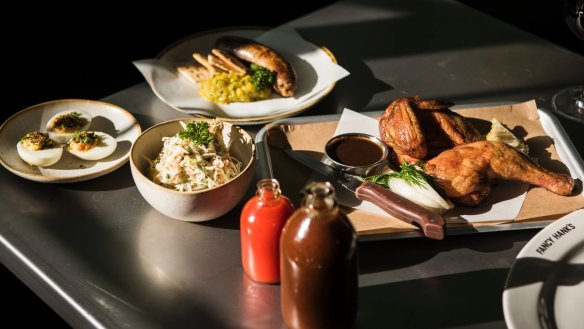 Barbecue chicken, boudin sausage, coleslaw and devilled eggs served at Fancy Hank's.