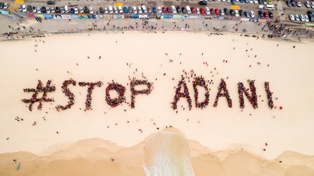 Organisers estimated 1500 people gathered on Bondi Beach on Saturday to protest the Adani mine.