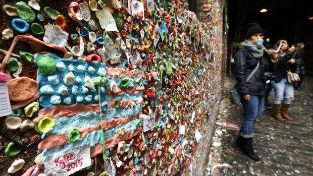 A United States flag made from pieces of gum sticks to a wall at Seattle's "Gum Wall". 