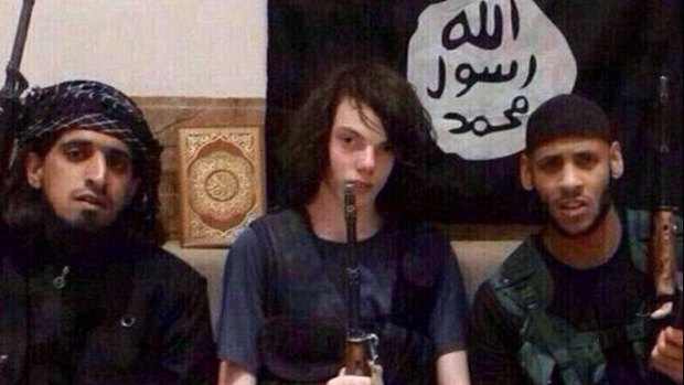 This photo with the ISIS flag in the background was posted on Twitter in December. 