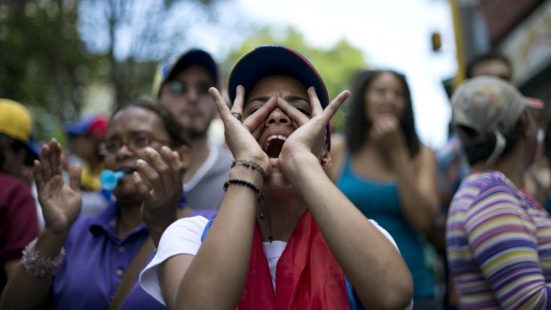 A demonstrator shouts against Venezuela's President Nicolas Maduro in Caracas.