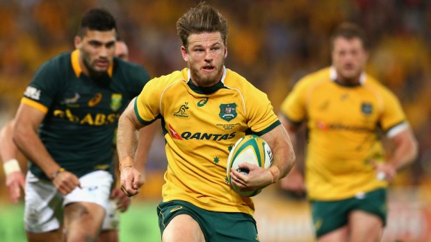 Excited: Rob Horne of the Wallabies runs the ball against the Springboks in Brisbane. 