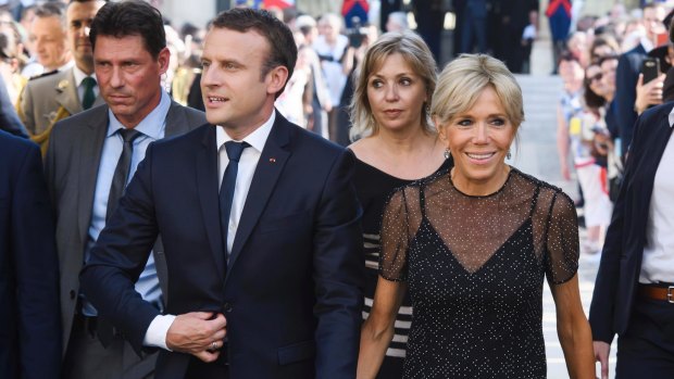 France's President Emmanuel Macron, left, and his wife Brigitte Macron awaiting Colombia's President Juan Manuel Santos and his wife Maria Clemencia Rodriguez for a dinner at the Elysee Palace in Paris, France, Wednesday, June 21, 2017.