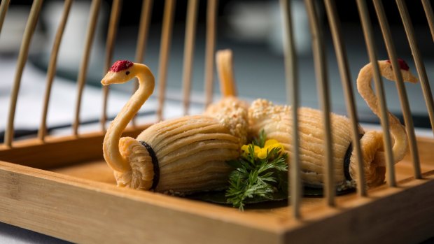 "Heavenly Swans" wrought in crisp layers of pastry are filled with sweet lotus paste.