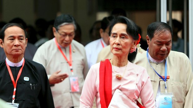 Myanmar's State Counsellor Aung San Suu Kyi, second from right, arrives to attend the Forum on Myanmar Democratic Transition last month in Naypyitaw.