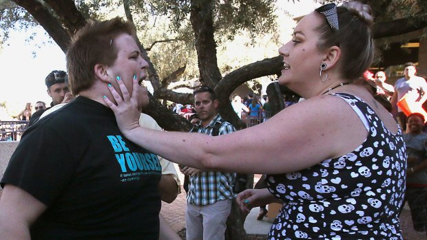 A Donald Trump protester and supporter in an altercation at the conclusion of a Trump rally at the Tucson Convention Centre on Saturday.
