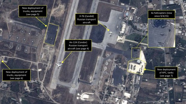 Major commitment: a satellite image shows Russian transport aircraft, helicopters, tanks, trucks and armoured personnel carriers at an air base in Latakia in Syria.