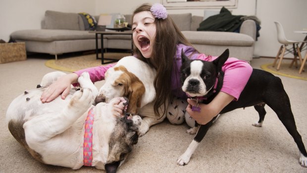 India Brewer with her three dogs, all vegan.