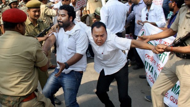 Indian police detain protesters following the  lynching of a man accused of rape in north-east India last week. 