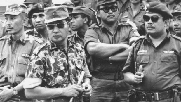 Former Indonesia president Suharto (in patterned uniform) was a major-general in 1965. Here he attends the funeral of the slain generals. He had a leading role in the anti-communist crackdown and massacres that followed.