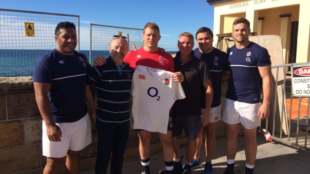 Grand gesture: England captain Dylan Hartley and team mates with Coogee Surf Life Saving Club president Mark Doepel (left) and club life member Matt Scanlon. 