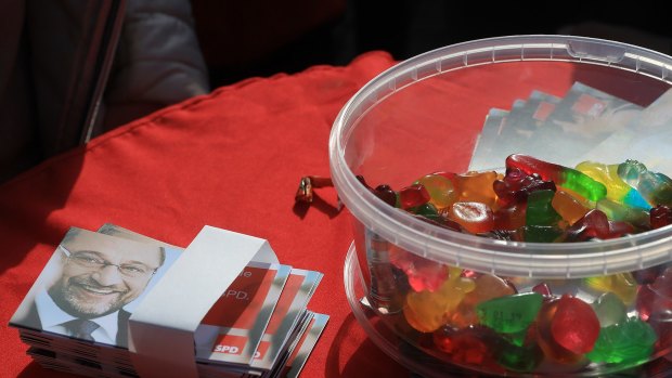 Campaign leaflets for Martin Schulz sit beside a tub of candy a campaign rally on Friday.