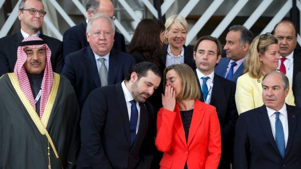 Lebanese Prime Minister Saad Hariri, centre left, speaks with the European Union's Federica Mogherini in Brussels. 
