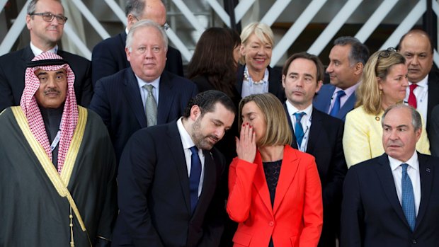 Lebanese Prime Minister Saad Hariri, centre left, speaks with the European Union's Federica Mogherini in Brussels. 