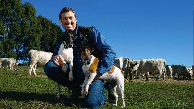 The late interior designer Stuart Rattle with his fox terriers at Musk Farm in Daylesford.