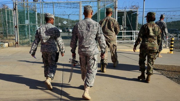 Military guards exit an area known as Camp Delta at the Guantanamo Bay detention centre in Cuba this month. After 14 years, the detention centre is winding down.