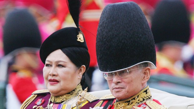 King Bhumibol Adulyadej and Queen Sirikit review the honour guard in 2005.