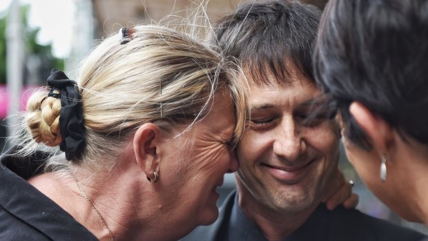 Victim Mark Boughton with his wife Belinda after former Catholic priest John Joseph Farrell was sentenced to 29 years in jail. 