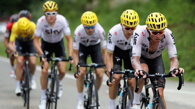 The Sky train protecting yellow jersey Chris Froome en route to Station Des Rousses.