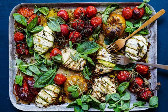 Bundles of joy: Tomato traybake with zucchini cheese parcels.