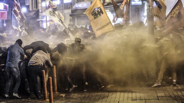 Under fire: Police used tear gas and water cannon on protesters in Istanbul.