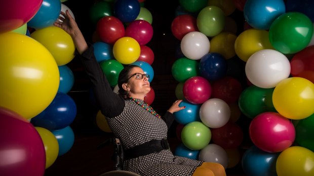 Artist Noemi Lakmaier will be lifted up by 20,000 balloons for nine hours at Sydney Opera House on Sunday. 