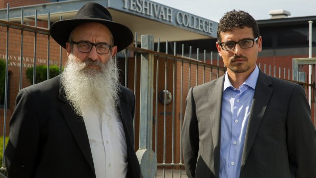 Manny Waks, right, with his father Zephaniah in front of the Yeshivah College.