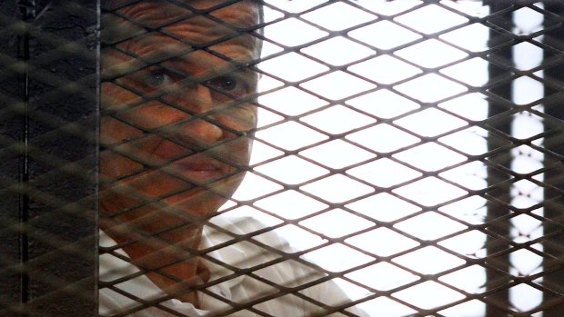 Al-Jazeera journalist Peter Greste in the defendant's cage during a sentencing hearing in Cairo in 2014.