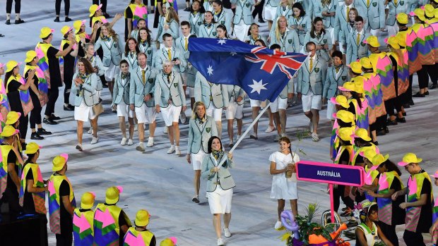 Australia flag bearer Anna Meares leads the team into the stadium.