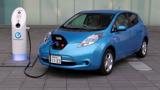 A Nissan Leaf electric car is recharged.
