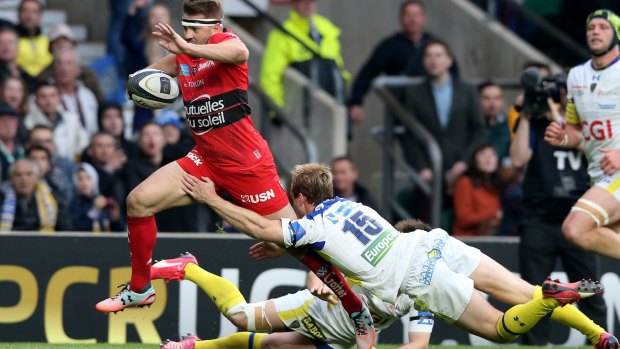 Tackle bust:  Drew Mitchell of Toulon breaks through the tackle from Nick Abendanon of Clermont en route to scoring a solo try.
