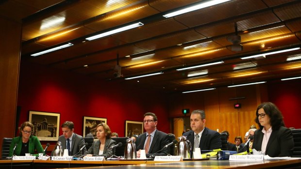 Representatives of big pharmaceutical companies attend the Senate inquiry into corporate tax avoidance last year.
